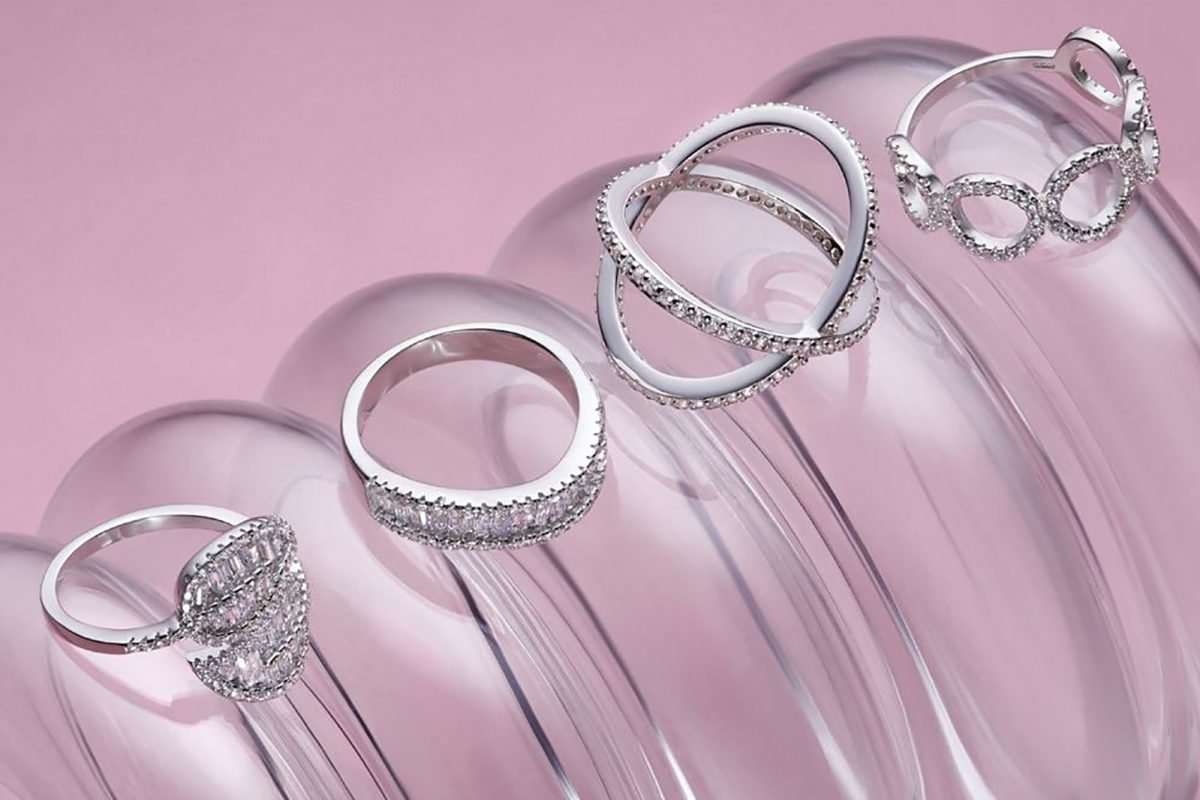 Silver-rings-bundle-on-pink-in-lifestyle-photography-studio-reflecting-professional-photography-for-social-media-charm